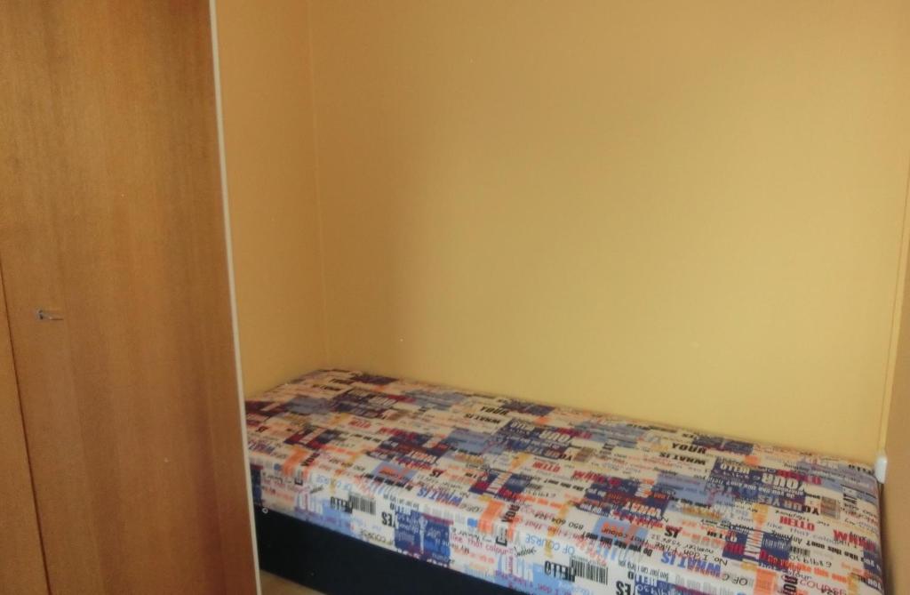 Postel nebo postele na pokoji v ubytování RUTH Haus KMB Seeblickappartement am Ossiacher See mit direktem Seezugang, Hallenbad