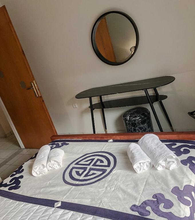 A bed or beds in a room at Sofia City Beach 3 Apts Nea Chora Chania steps from the beach