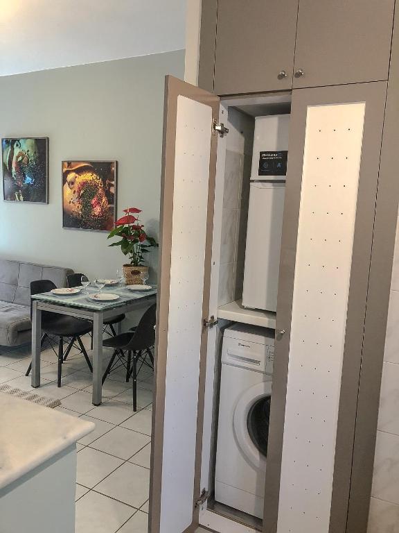 A kitchen or kitchenette at Sofia City Beach 3 Apts Nea Chora Chania steps from the beach