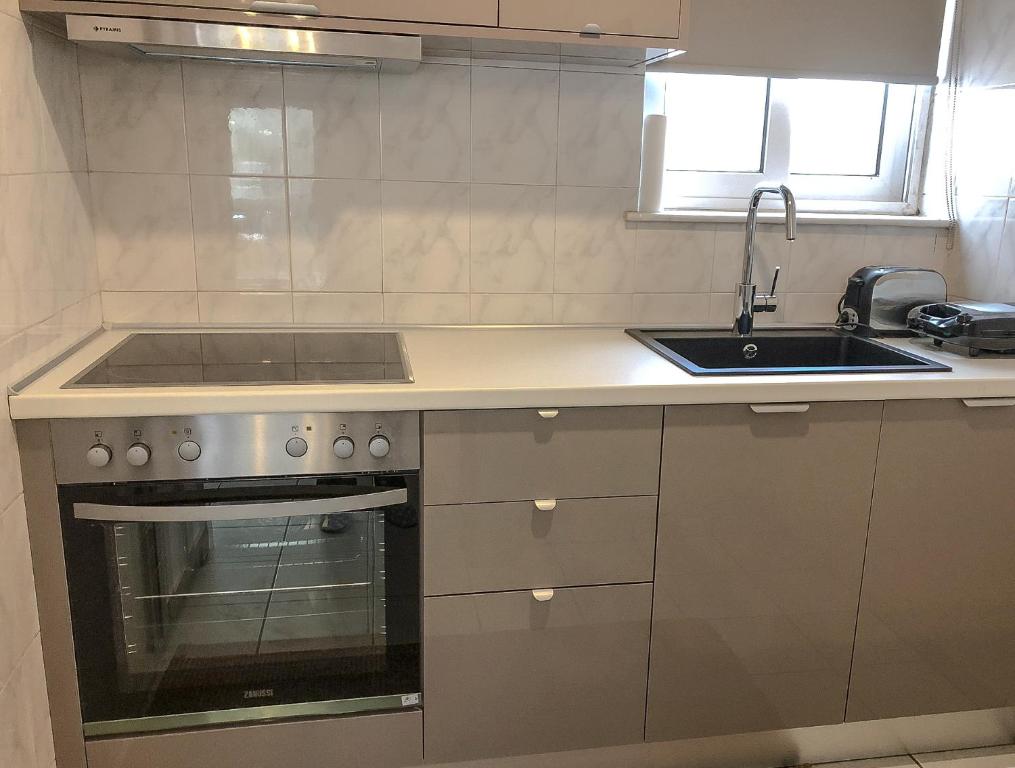 A kitchen or kitchenette at Sofia City Beach 3 Apts Nea Chora Chania steps from the beach