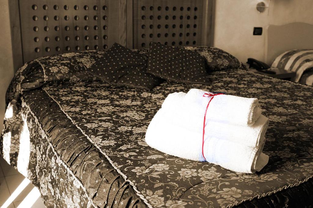 Posteľ alebo postele v izbe v ubytovaní Hotel Ulisse