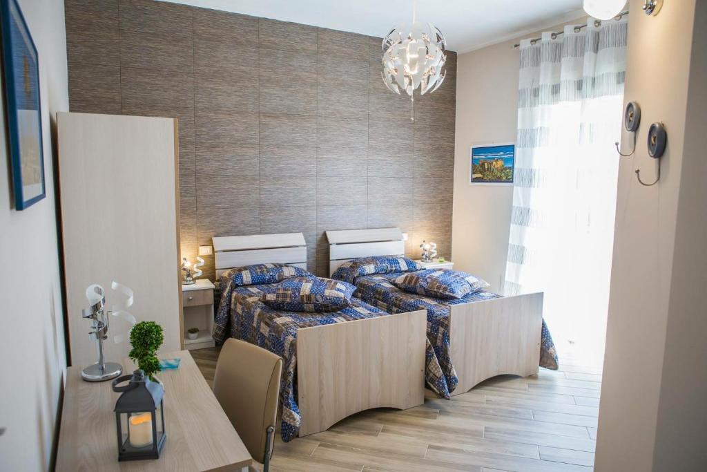 Postel nebo postele na pokoji v ubytování le Notti di Morfeo