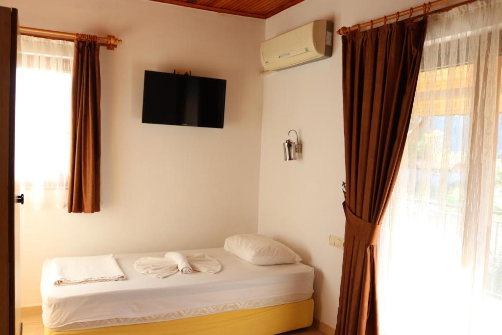 Postel nebo postele na pokoji v ubytování Plaj Hotel