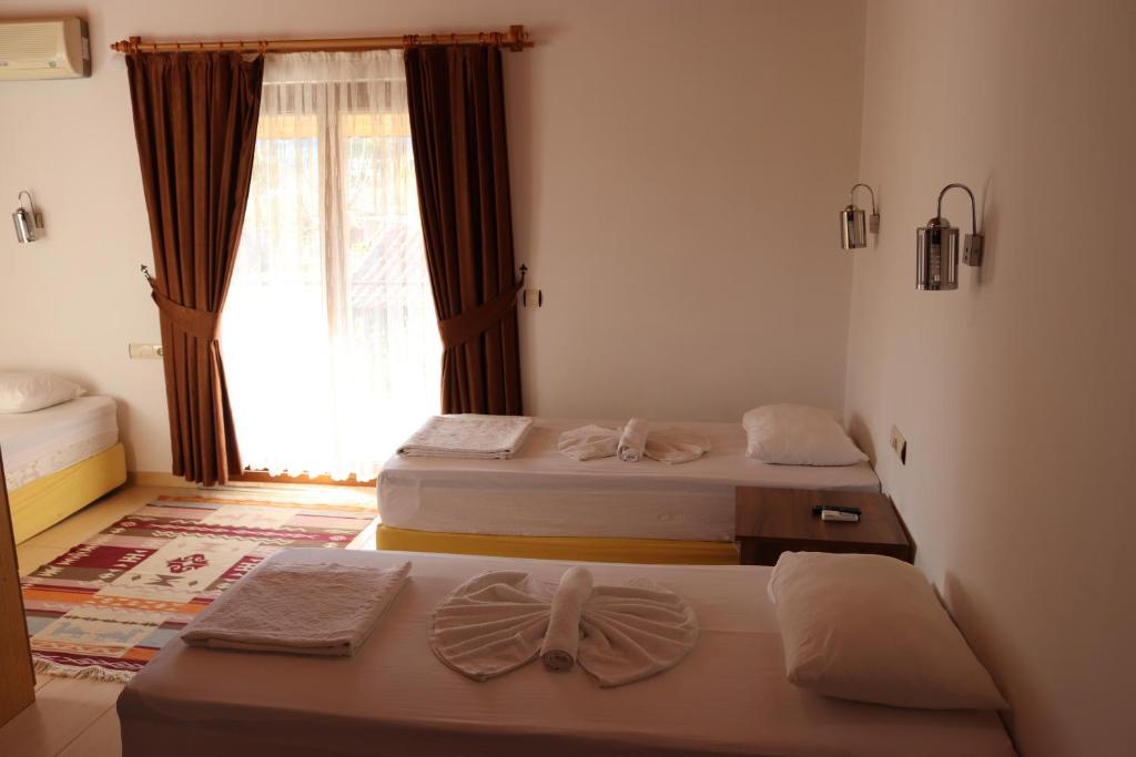Postel nebo postele na pokoji v ubytování Plaj Hotel