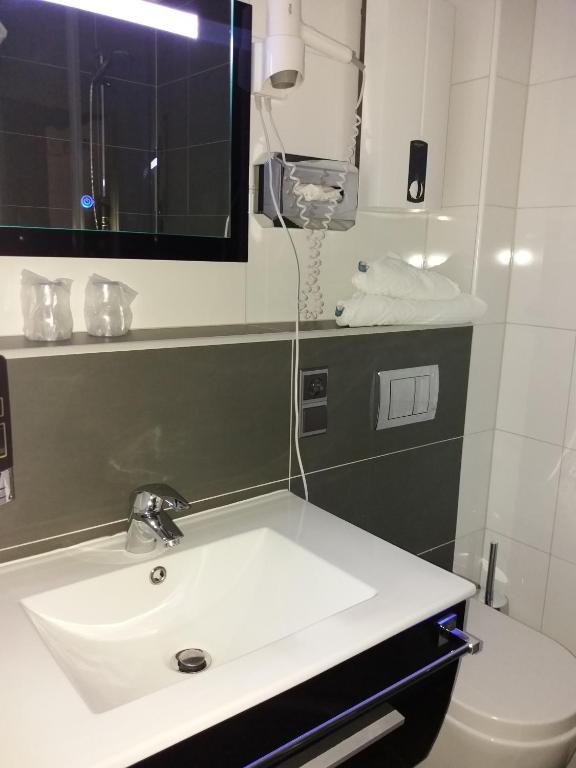 Koupelna v ubytování Hotel Garni Regent