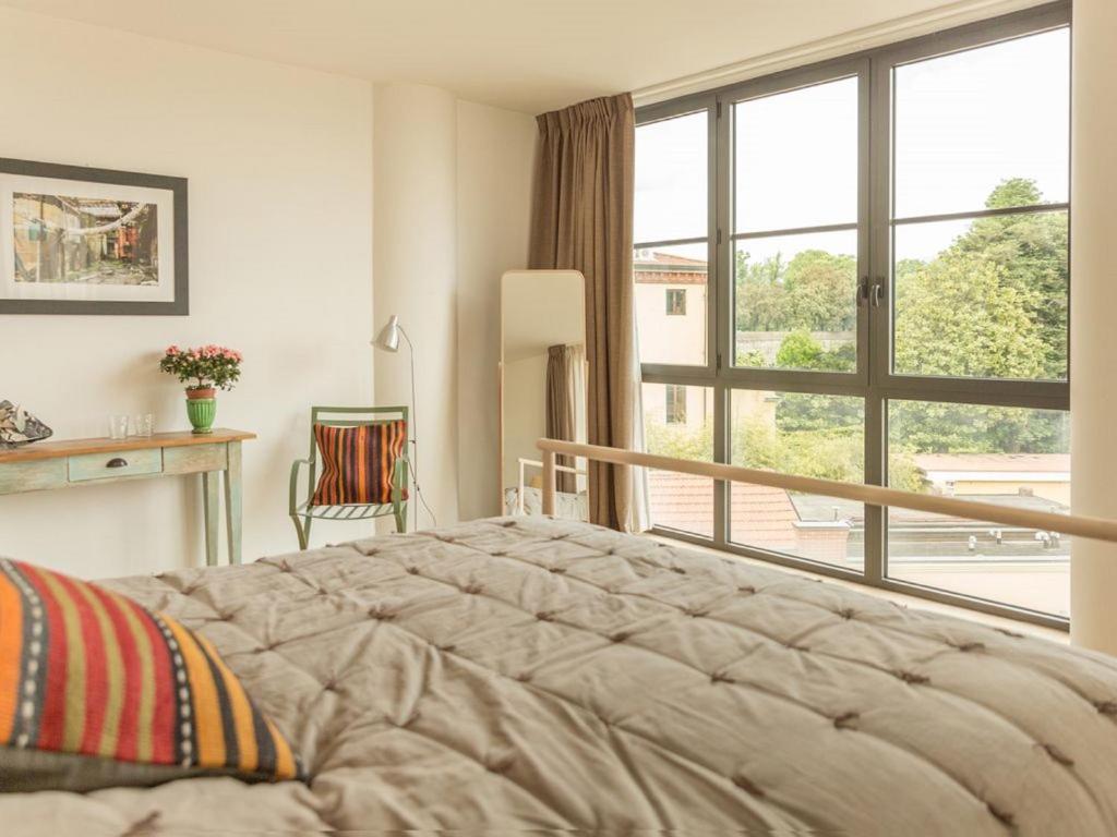 A bed or beds in a room at ATTICO DELLA LATTA