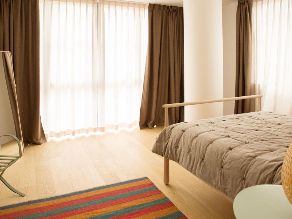 A bed or beds in a room at ATTICO DELLA LATTA