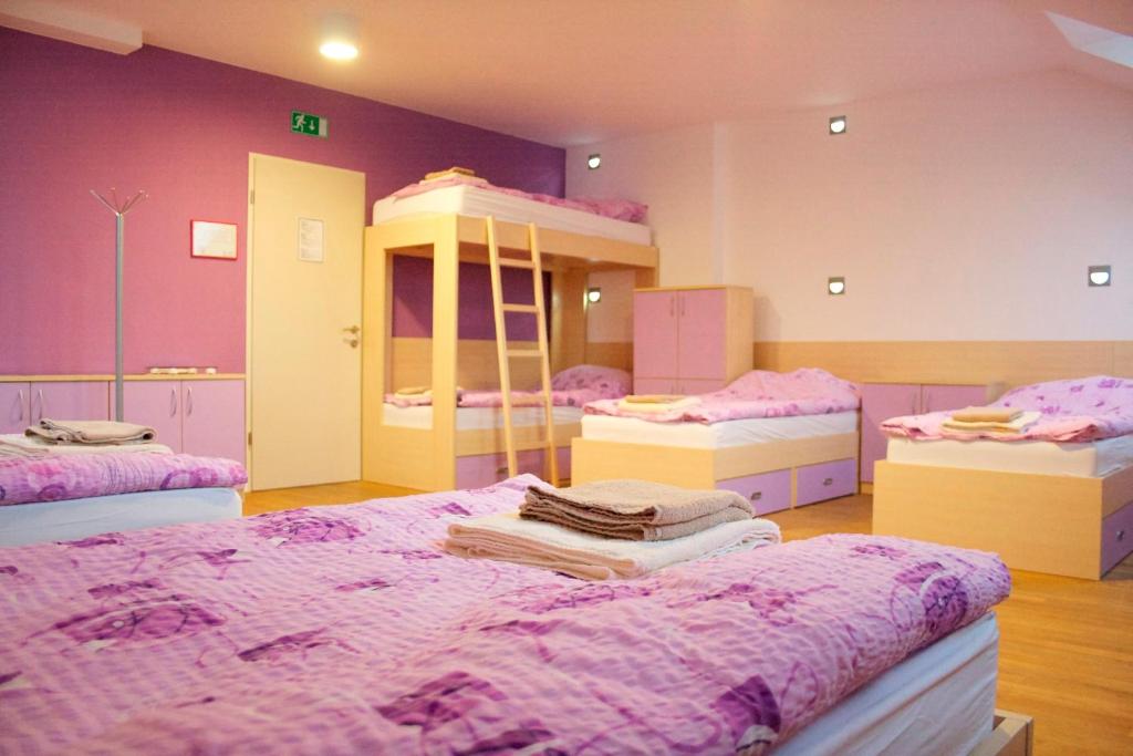 a room with four bunk beds in it at Youth Hostel Krško in Krško