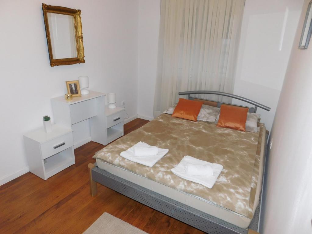 Postel nebo postele na pokoji v ubytování Apartman Ana
