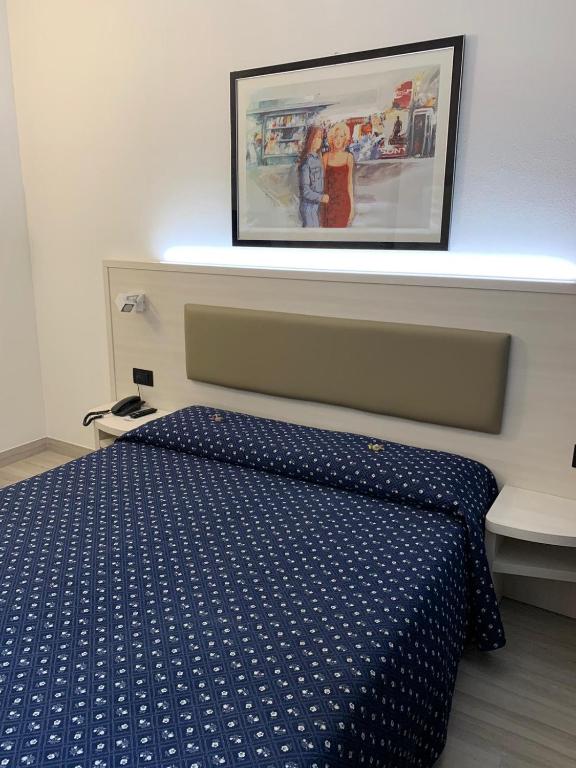 Postel nebo postele na pokoji v ubytování Hotel Giotto