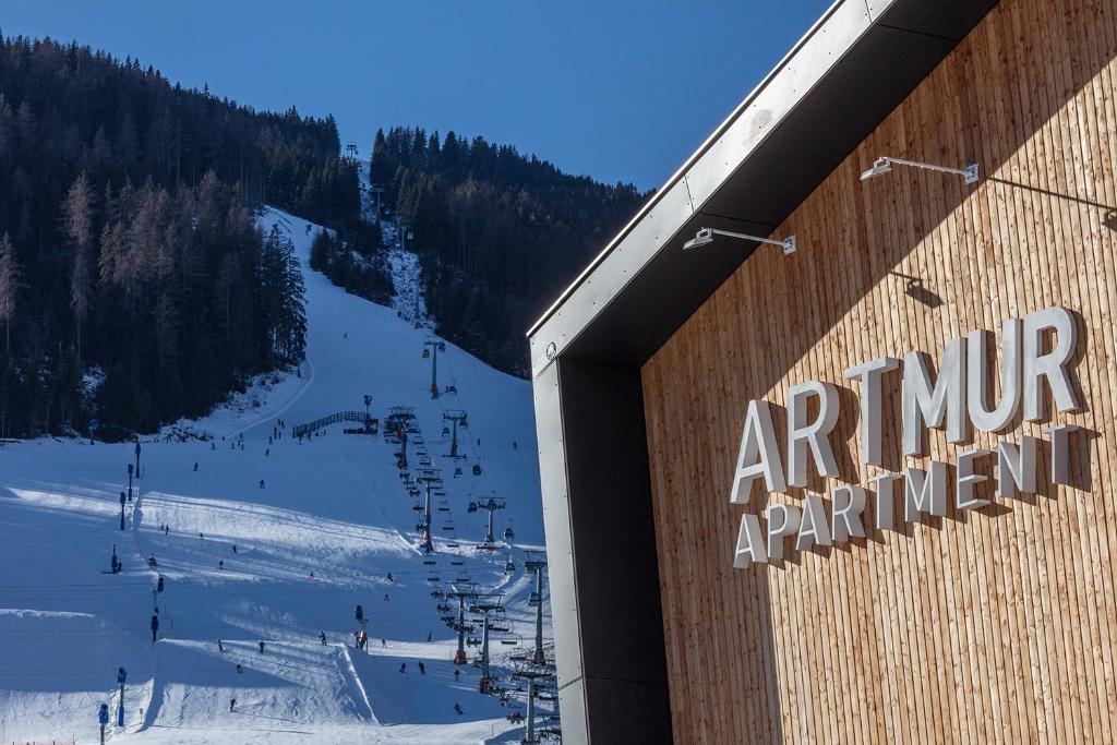 a sign for an entrance to a ski resort at ARTMUR Apartment in Sankt Georgen ob Murau