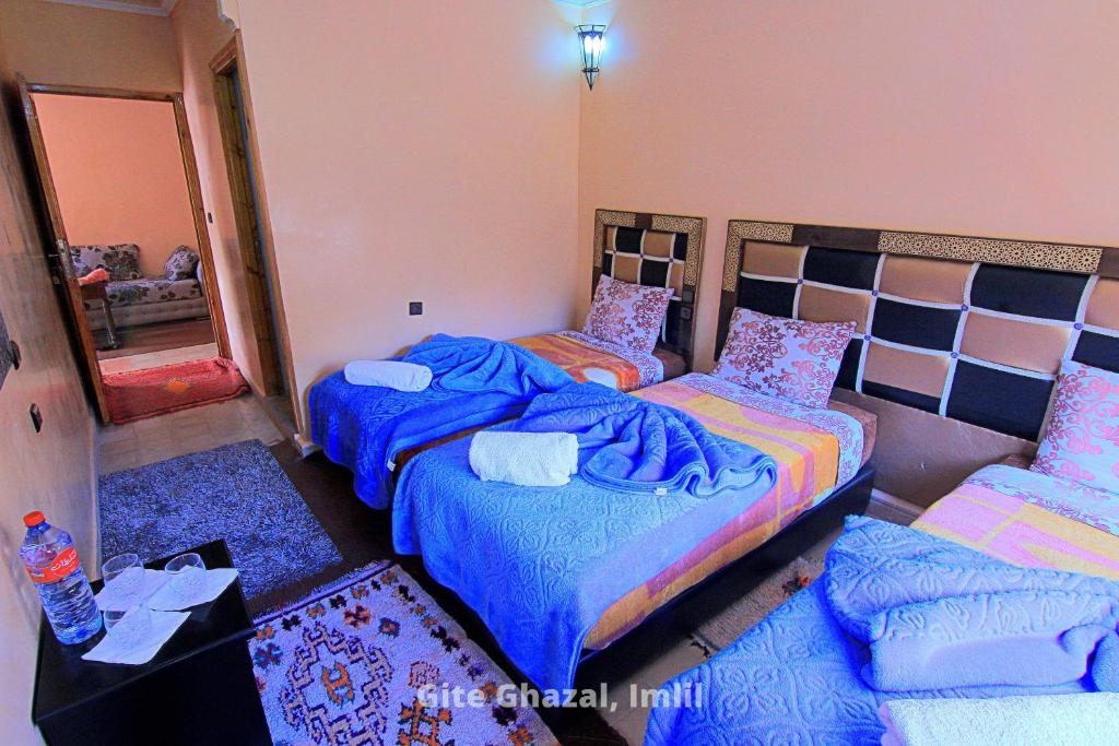 Postel nebo postele na pokoji v ubytování Gite Ghazal - Atlas Mountains Hotel