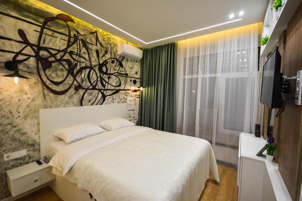 Postel nebo postele na pokoji v ubytování Kyiv Center Smart Apartments