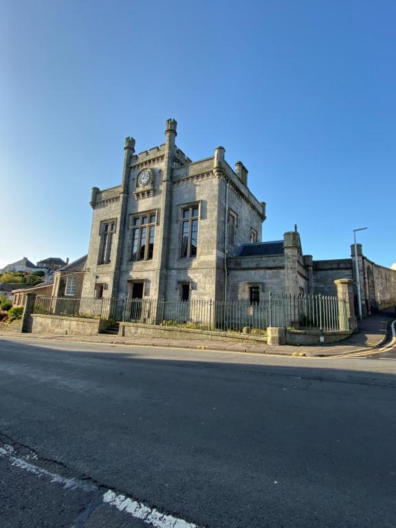 an old building with a clock on top of it at Kinghorn Town Hall in Kinghorn