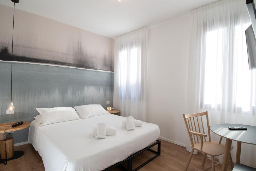 Postel nebo postele na pokoji v ubytování Hotel Rio