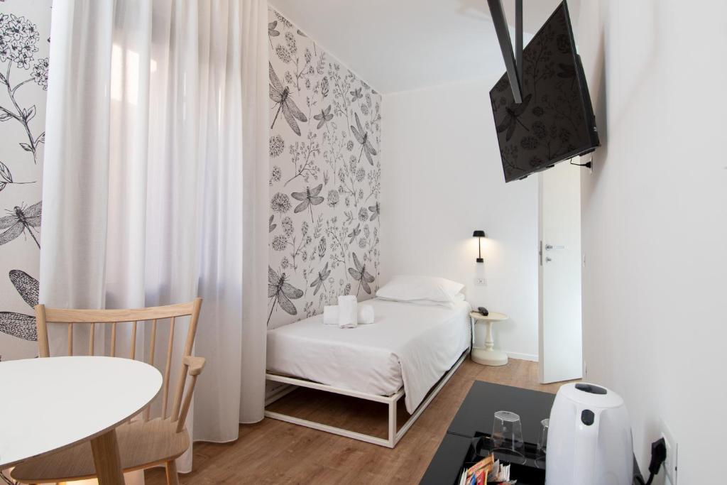Postel nebo postele na pokoji v ubytování Hotel Rio