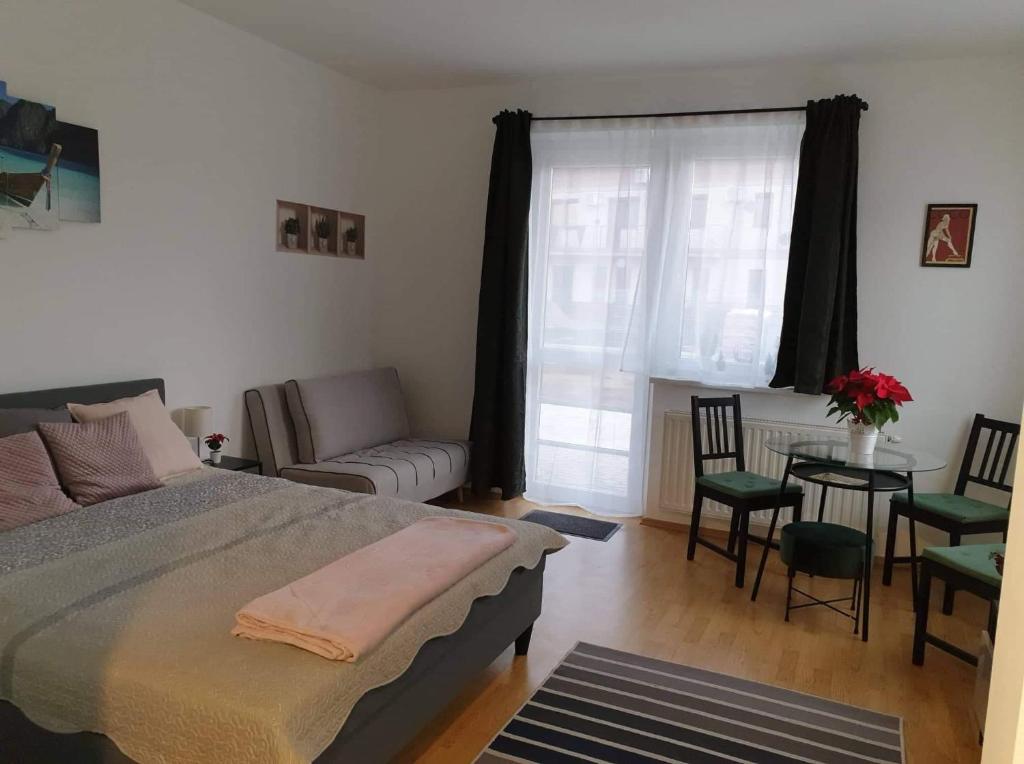 Кровать или кровати в номере Relax Apartman Veresegyház