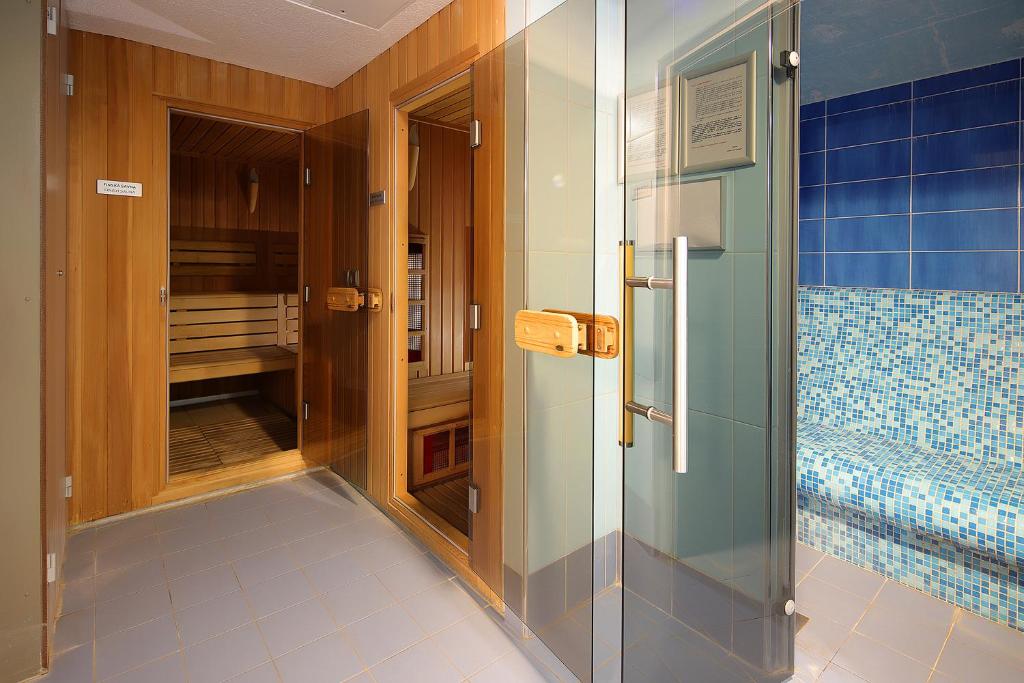 Postel nebo postele na pokoji v ubytování Hotel Lovec