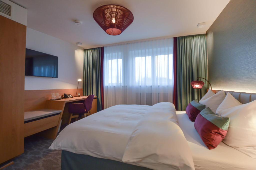 Postel nebo postele na pokoji v ubytování Hotel Boehler