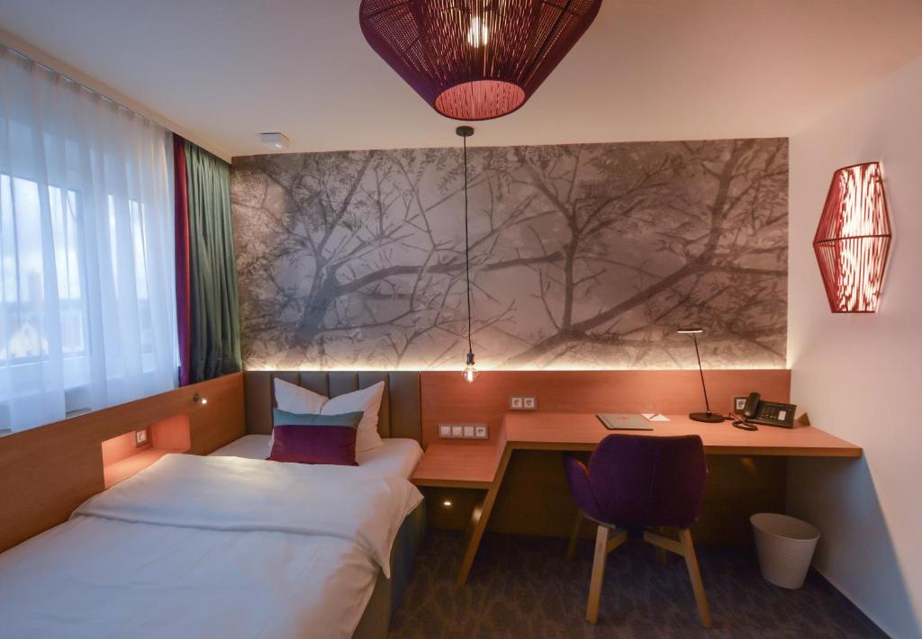 Postel nebo postele na pokoji v ubytování Hotel Boehler