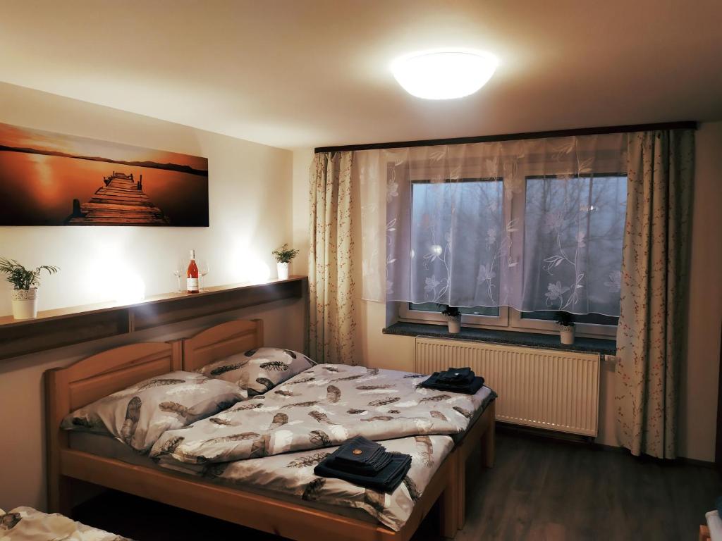 Postel nebo postele na pokoji v ubytování Apartmany De-Lu