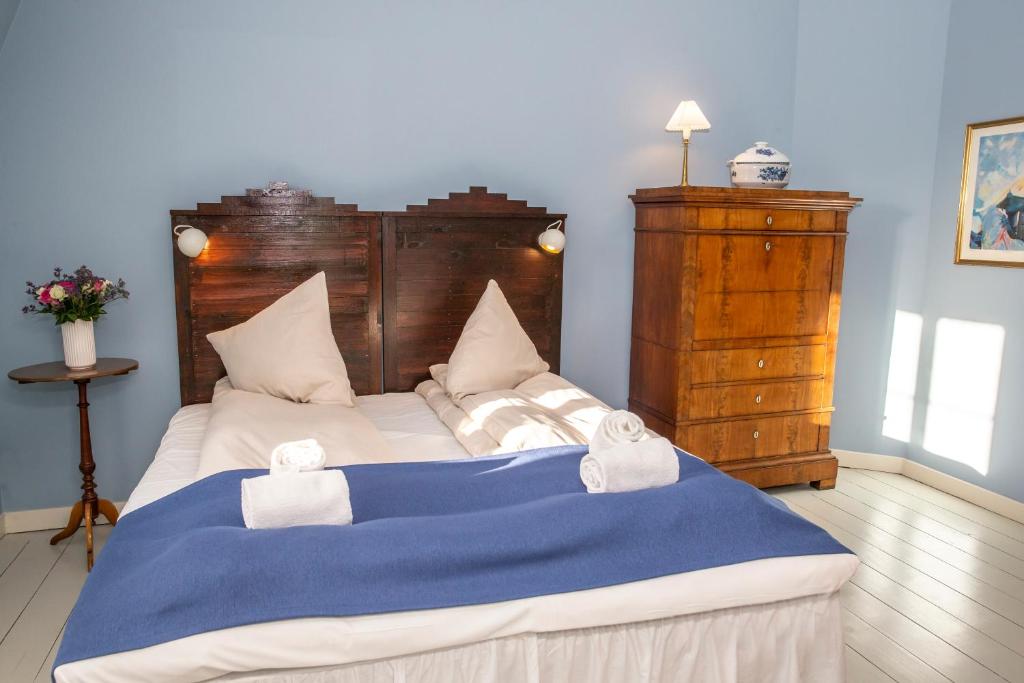 Postel nebo postele na pokoji v ubytování Fuglsang Herregaard Hotel