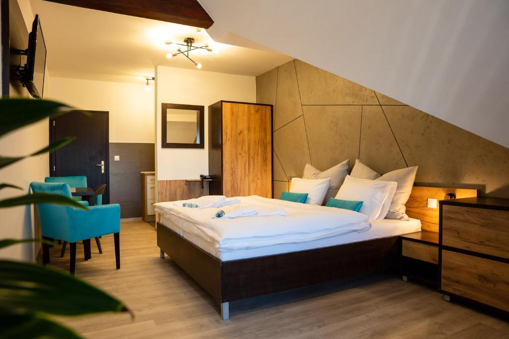 A bed or beds in a room at Apartmán Dagmar