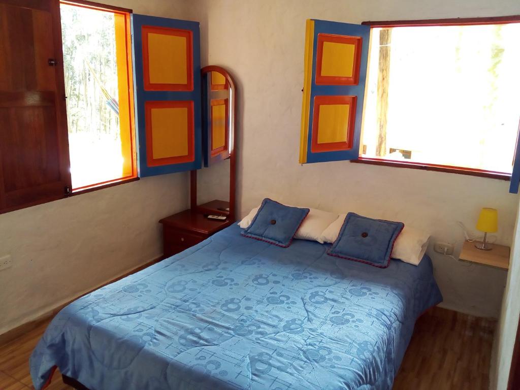 Postel nebo postele na pokoji v ubytování Hostal Encanto La Salada