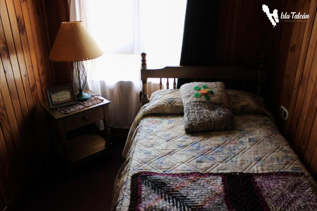 Cama o camas de una habitación en Hospedaje Isla Talcan