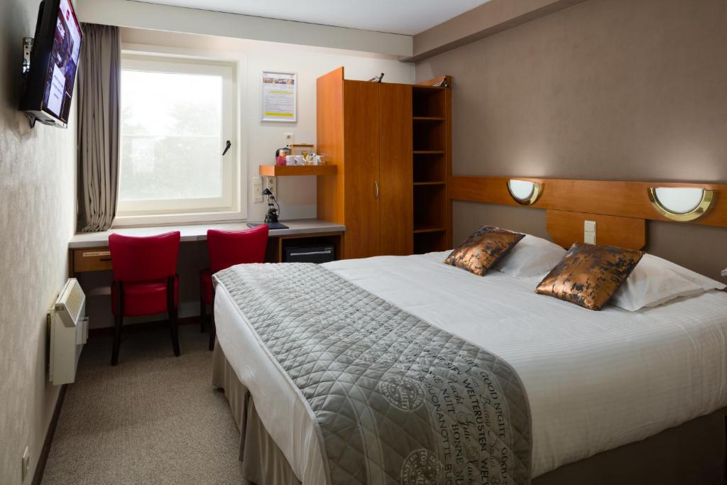 Postel nebo postele na pokoji v ubytování Vivaldi Hotel