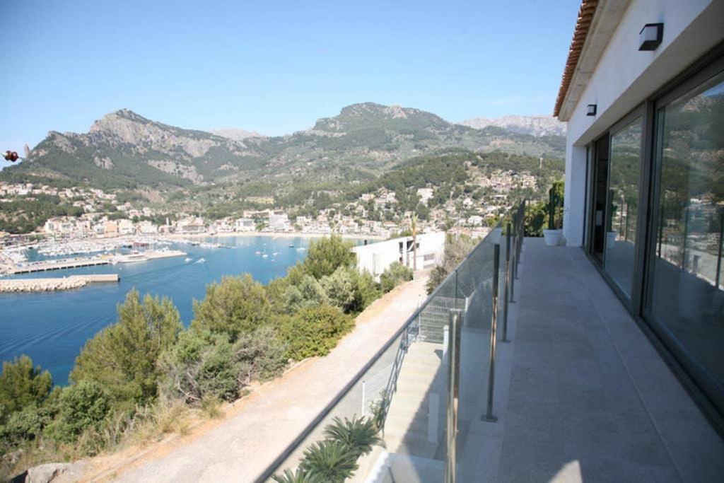 a balcony of a house with a view of the water at Villa Blau de Lluna in Port de Soller