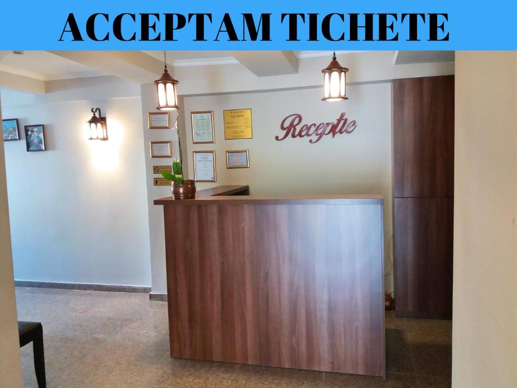 a reception desk in a hospital room with the words aclectrum medicine at Pensiunea La Iani in Constanţa