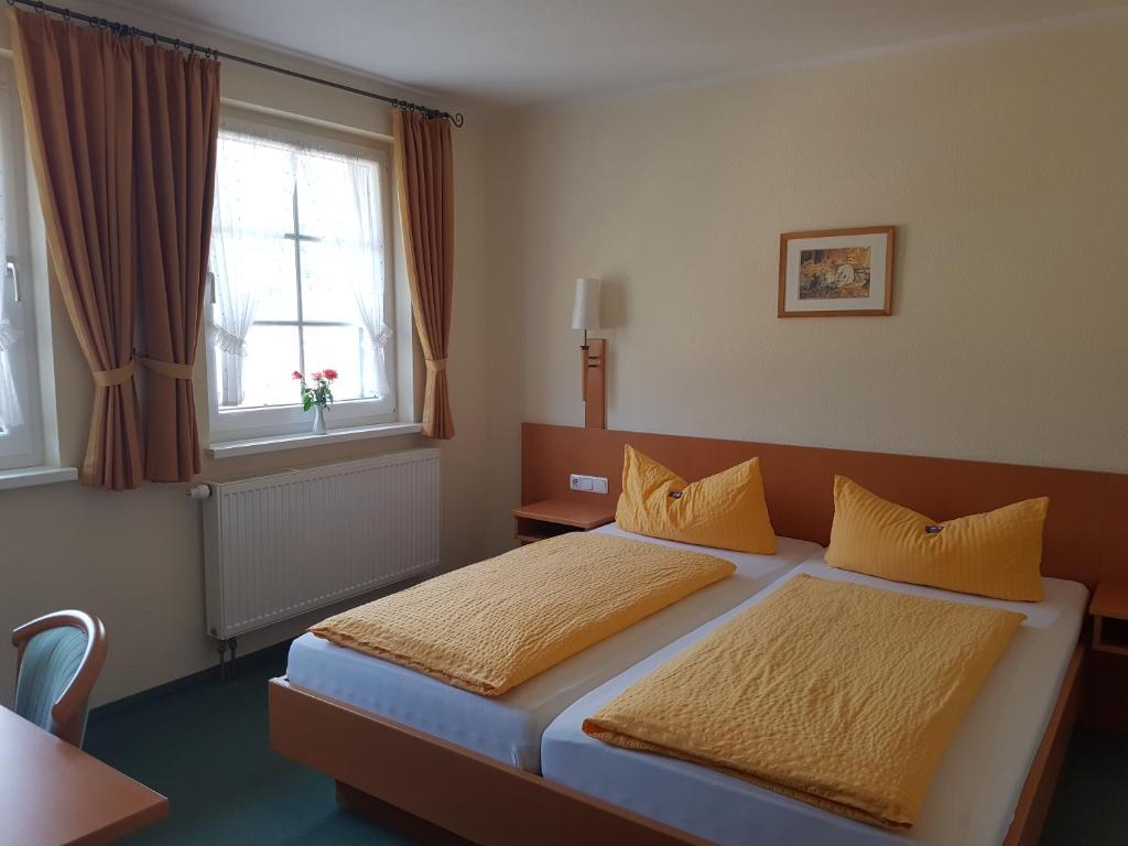 a hotel room with two beds and a window at Eisenbahnwelten in Kurort Rathen