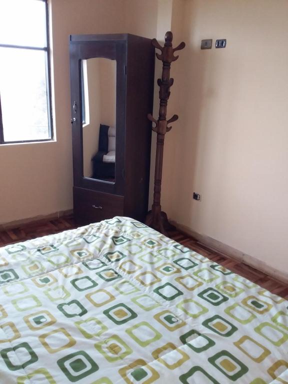 Postel nebo postele na pokoji v ubytování Hostal Nichkito