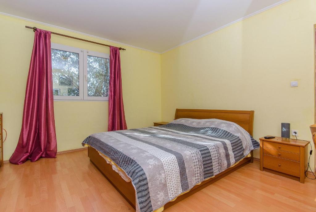 Postel nebo postele na pokoji v ubytování Apartments Ivan