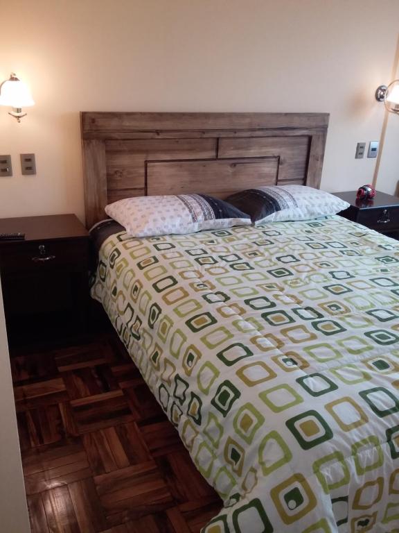 Postel nebo postele na pokoji v ubytování Hostal Nichkito