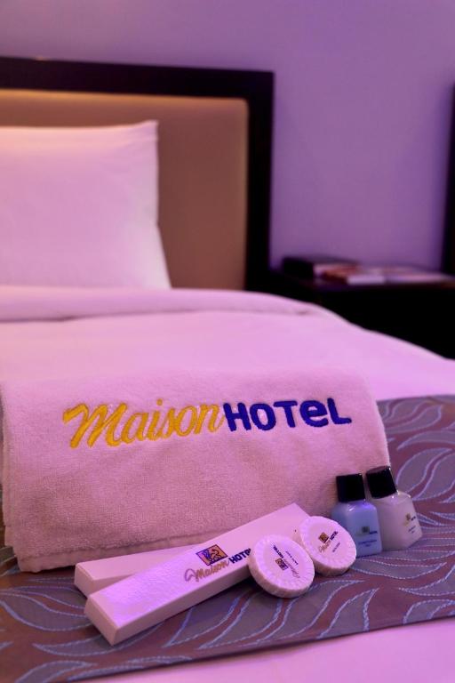 Postel nebo postele na pokoji v ubytování MAISON HOTEL