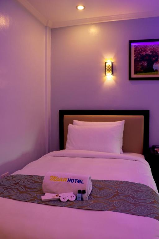 Postel nebo postele na pokoji v ubytování MAISON HOTEL