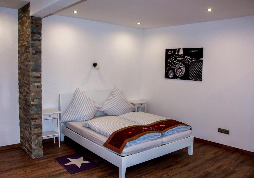 a bedroom with a bed with a picture of a car at Vintage Apartment in Adenau
