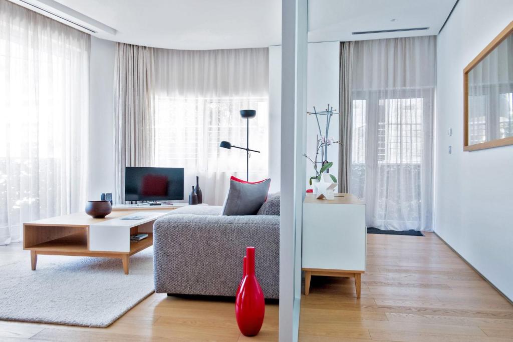 a living room with a couch and a table at Dukley Hotel & Resort in Budva