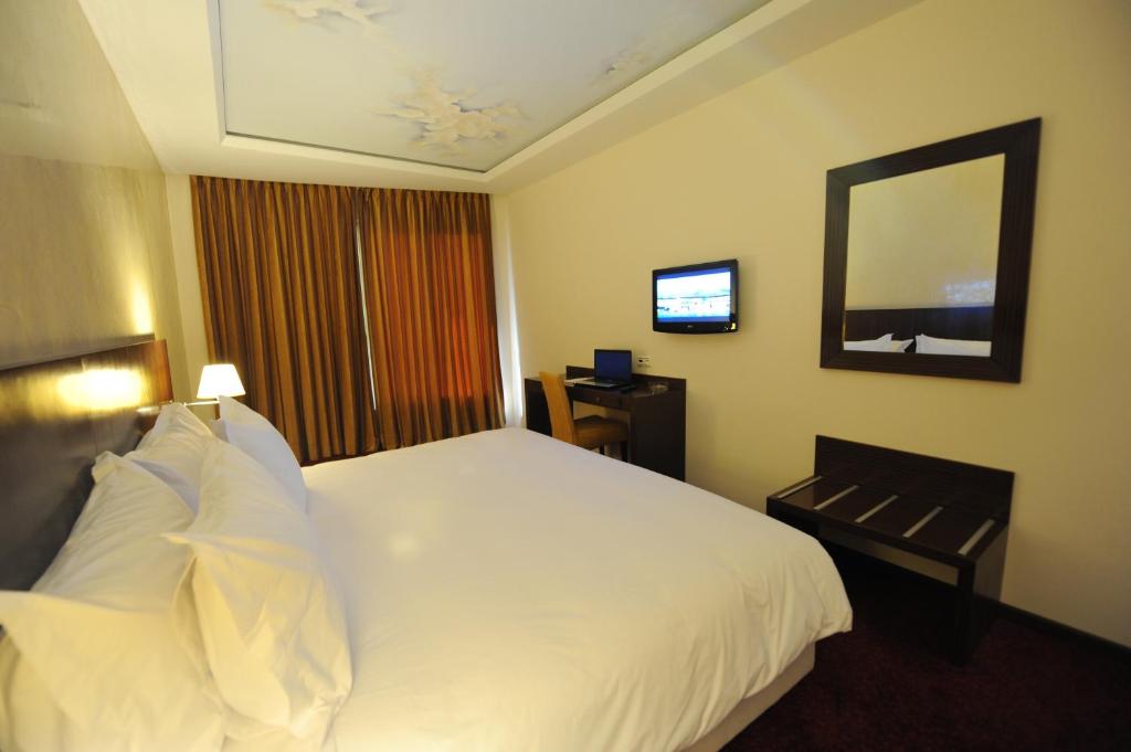 Postel nebo postele na pokoji v ubytování Rive Hotel