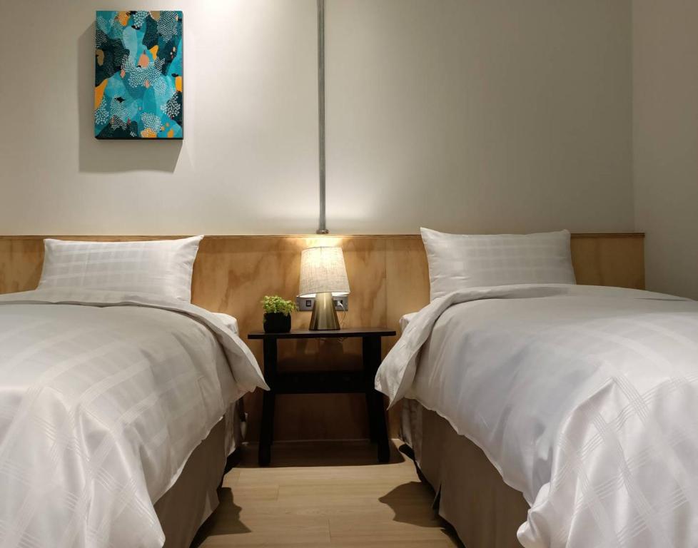 Postel nebo postele na pokoji v ubytování Home Rest Hotel 2