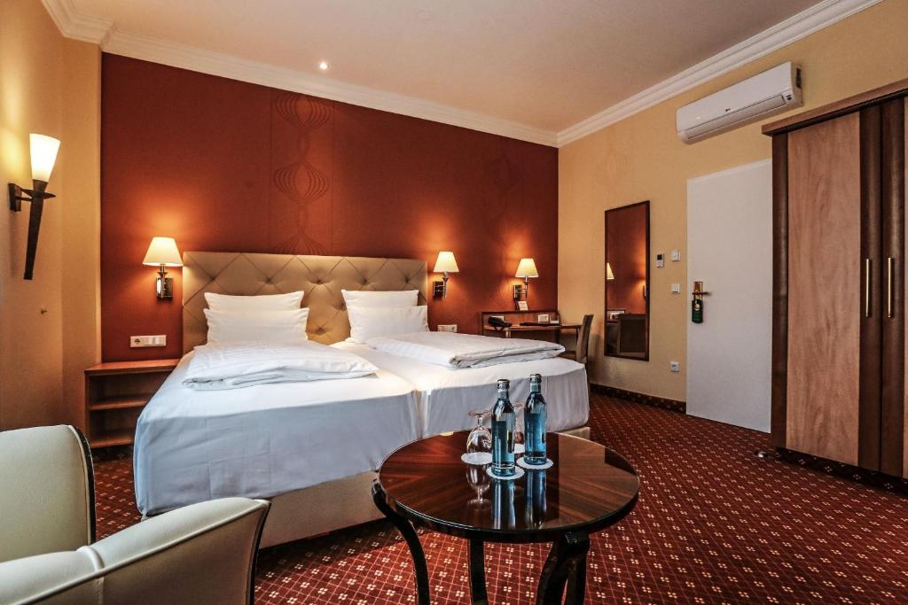 Postel nebo postele na pokoji v ubytování Hotel Mack Private Inn