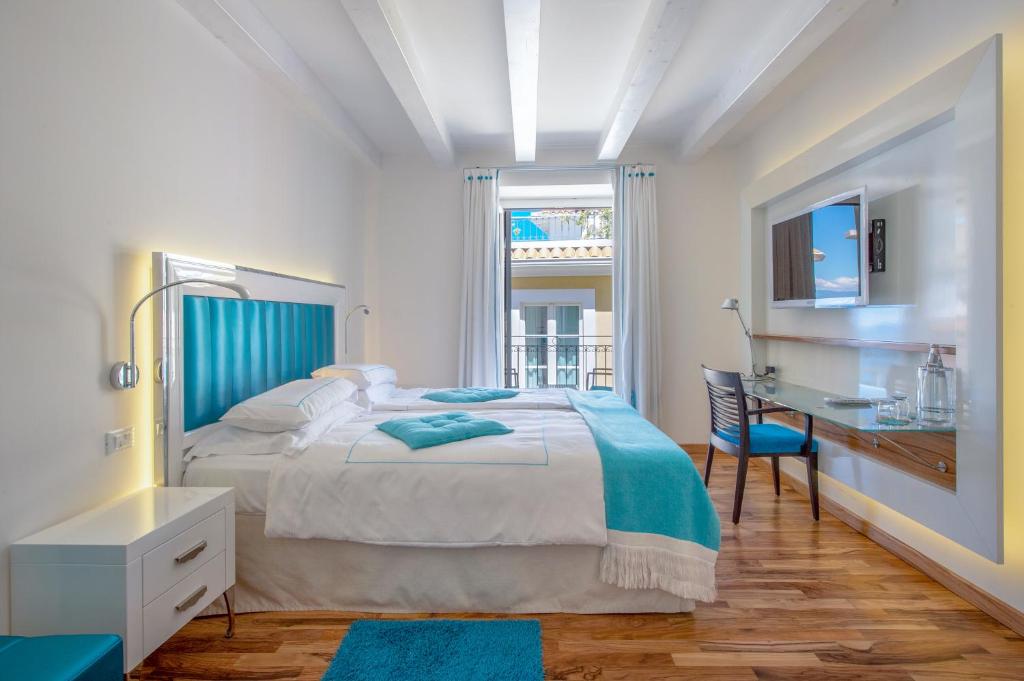 Letto o letti in una camera di Piccolo Grand Hotel