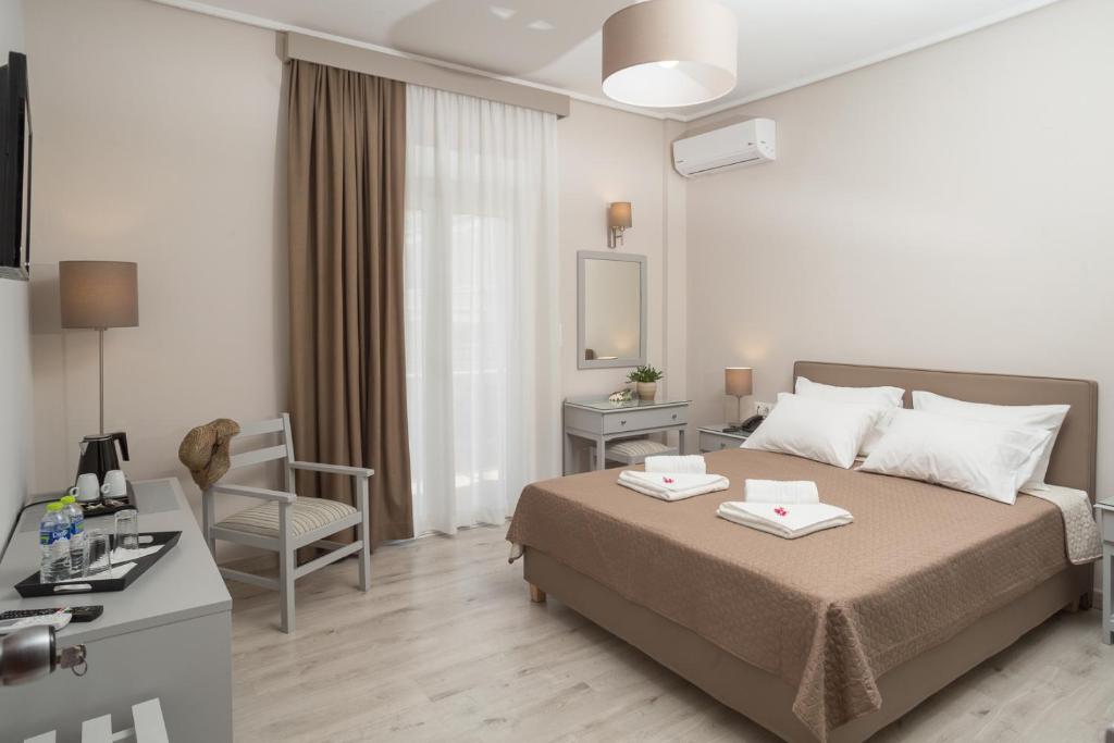 Postel nebo postele na pokoji v ubytování Hotel Alkyon