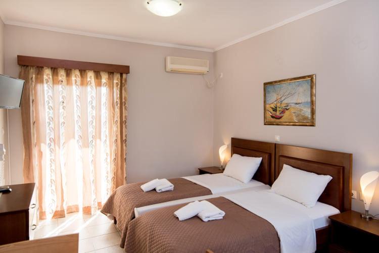 Postel nebo postele na pokoji v ubytování Katerina Hotel
