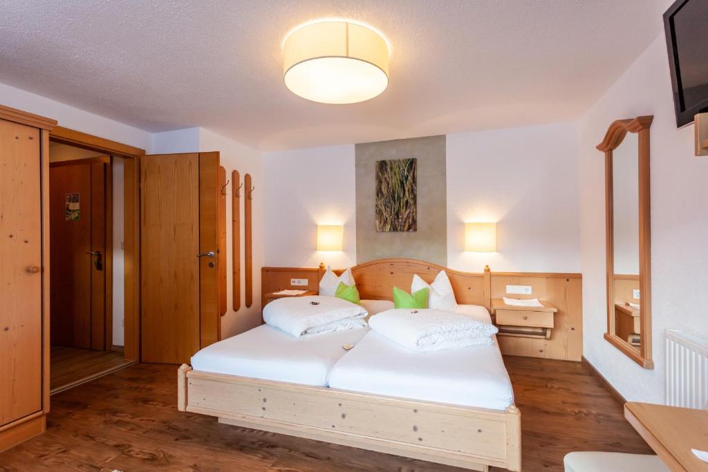 Postel nebo postele na pokoji v ubytování Haus Aktiv