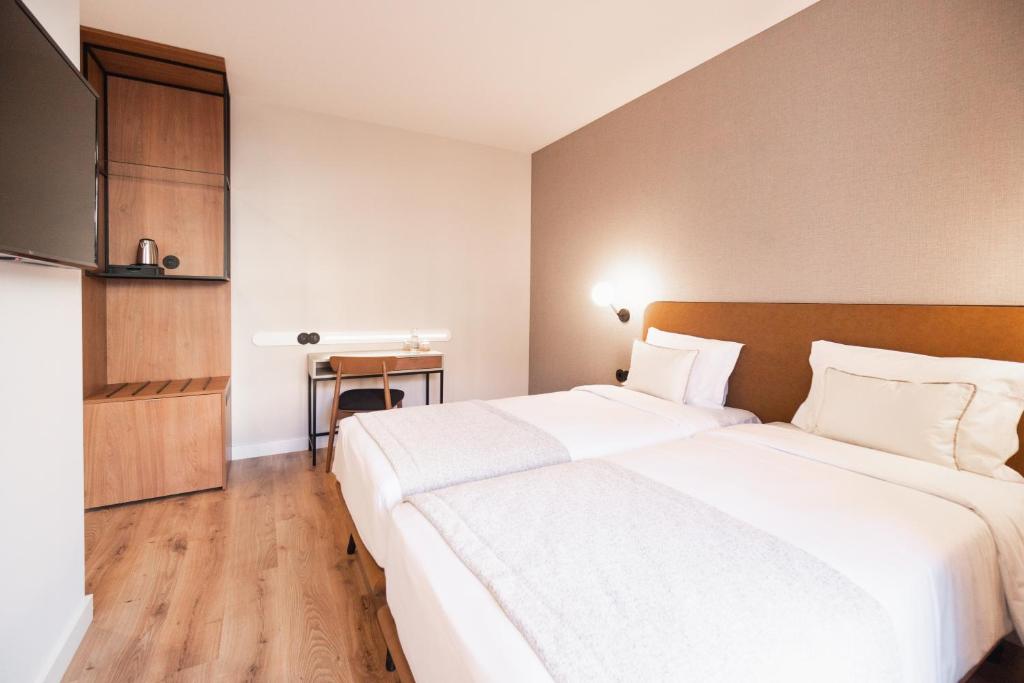 Postel nebo postele na pokoji v ubytování LX SoHo Boutique Hotel by RIDAN Hotels
