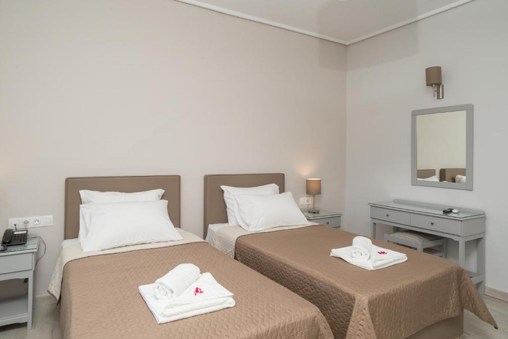Postel nebo postele na pokoji v ubytování Hotel Alkyon