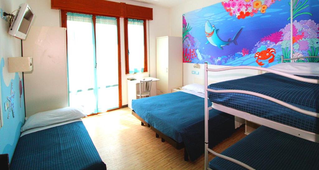 Postel nebo postele na pokoji v ubytování Hotel Fabrizio